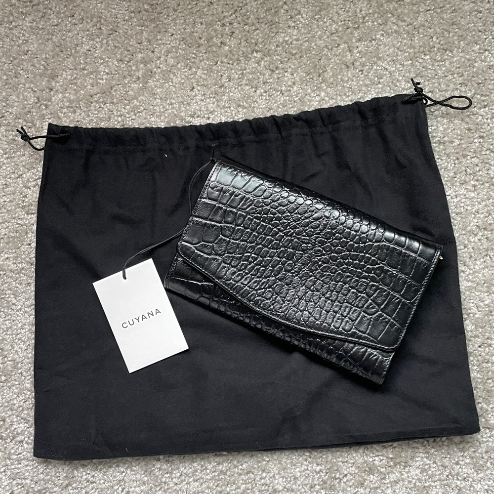 Cuyana embossed croc clutch in black. Crocodile leather convertible purse wallet